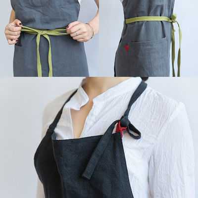 Τελευταία μοντέρνα Unisex Custom Cotton Λινό Cross Back Ρυθμίσιμη Μπιμπ Πρόποση με τσέπες